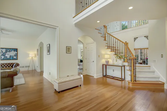 a view of a dining room with furniture wooden floor and chandelier