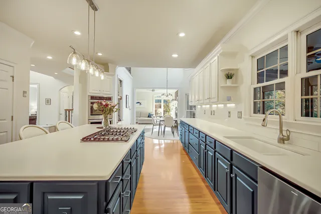a view of walk in closet with clothes