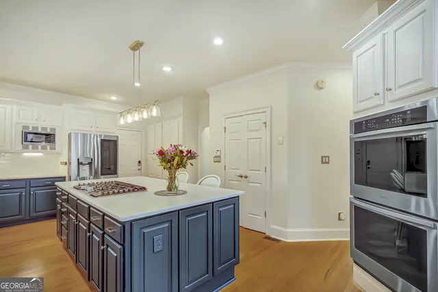 a bathroom with a toilet sink a mirror and shower curtain