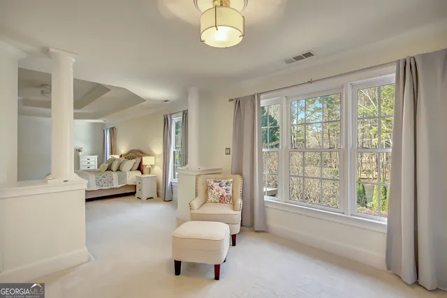 a view of a yard with large trees