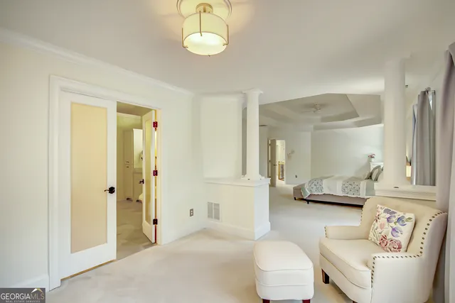 a view of a street with a building and trees
