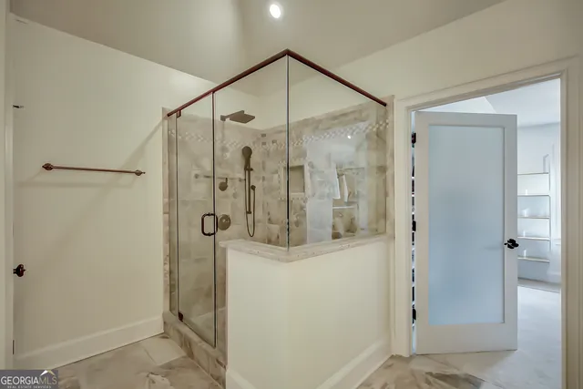 a view of a yard with large trees