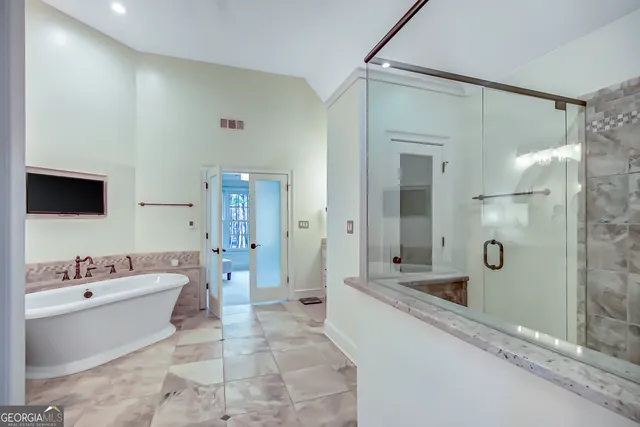 an aerial view of a house with pool patio and outdoor seating