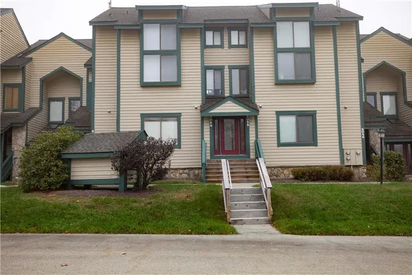 a front view of a house with a yard