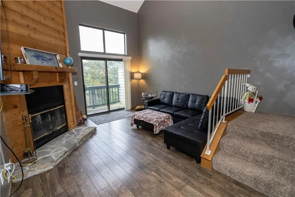 a living room with furniture fireplace and flat screen tv