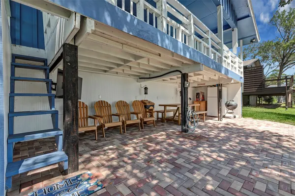 a view of a porch with wooden floor