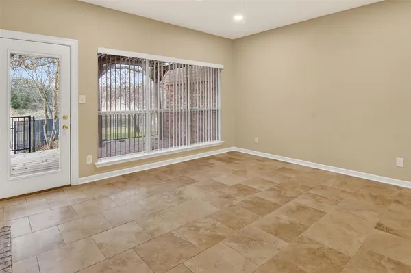a view of an empty room with a fireplace