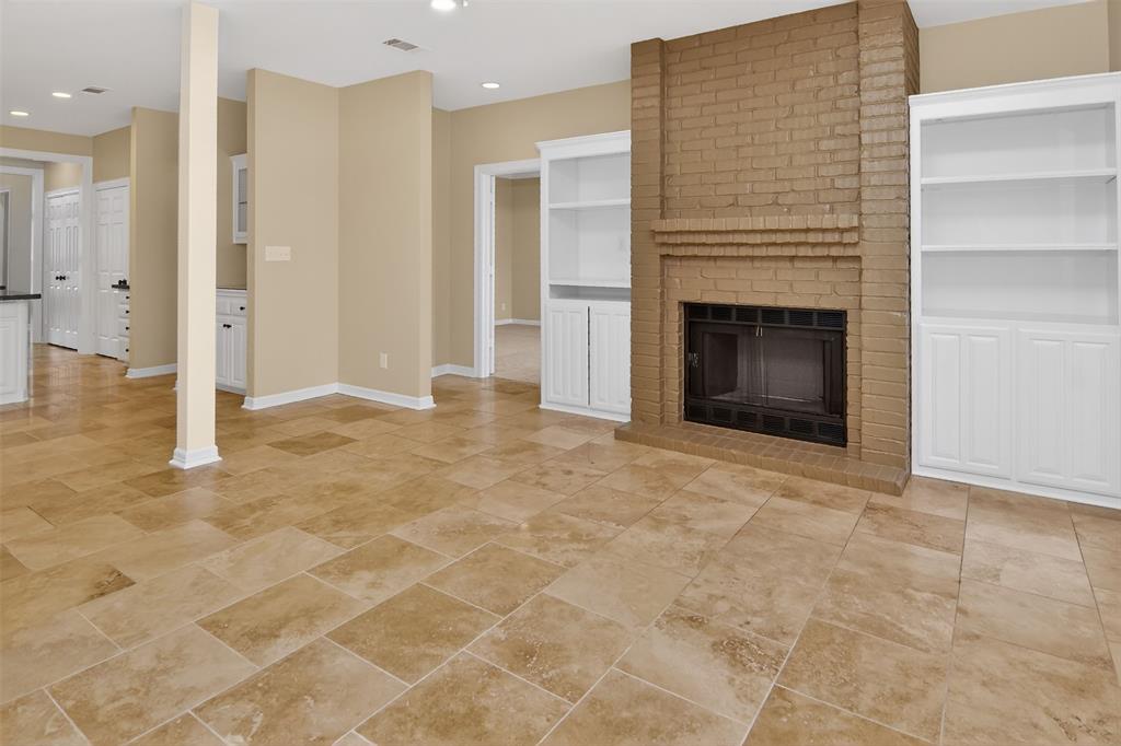 2122 Clear Lake Road Weatherford, TX 76087 - Photo 21 of 40 Spacious family room with wood-burning fireplace for chilly nights.