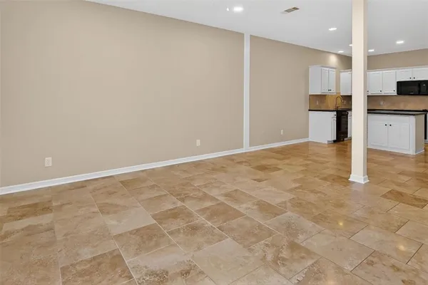 a view of an empty room and closet area