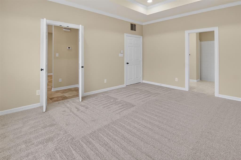 2122 Clear Lake Road Weatherford, TX 76087 - Photo 25 of 40 Double doors and second walk-in closet in primary bedroom and bath suite.