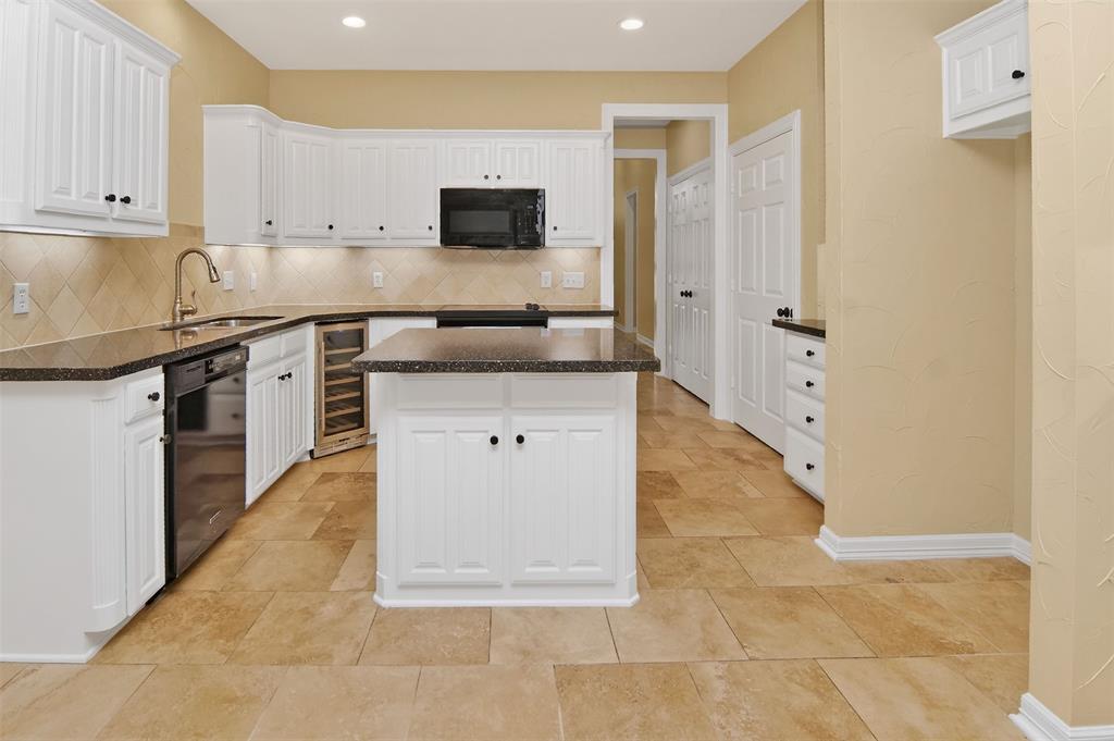 2122 Clear Lake Road Weatherford, TX 76087 - Photo 3 of 40 Kitchen with quart type counter tops, and island with storage.