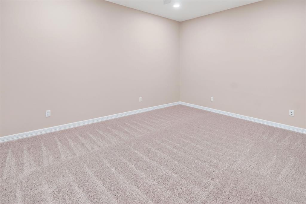 2122 Clear Lake Road Weatherford, TX 76087 - Photo 33 of 40 Second of three bedrooms with can lighting and ceiling fan.