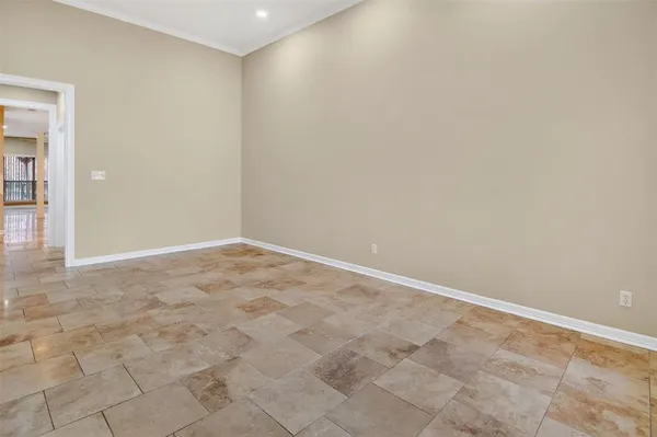a view of an empty room with a windows