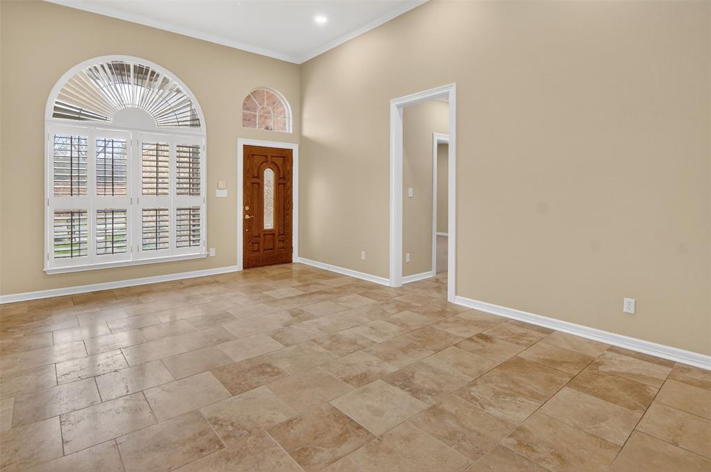 2122 Clear Lake Road Weatherford, TX 76087 - Photo 10 of 40 Front room can be purposed as a formal dining area and/or living room. Plantation shutters add beautiful detail.