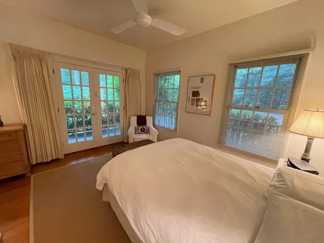 a bedroom with a bed and a mirror