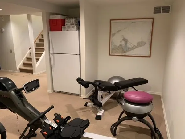 a room with furniture and air hockey table