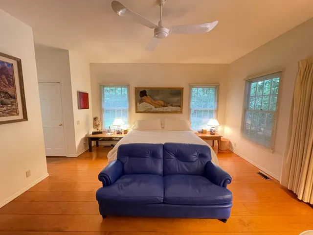 a living room with a couch and a fireplace