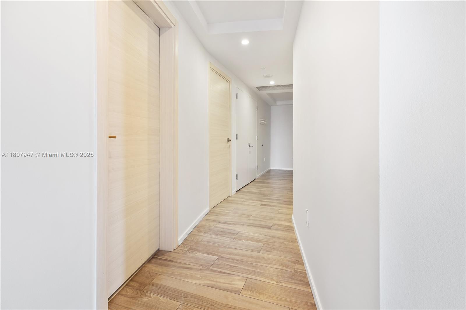 801 South Miami Avenue, Unit 2201 Miami, FL 33131 - Photo 12 of 37 a view of a hallway with wooden floor
