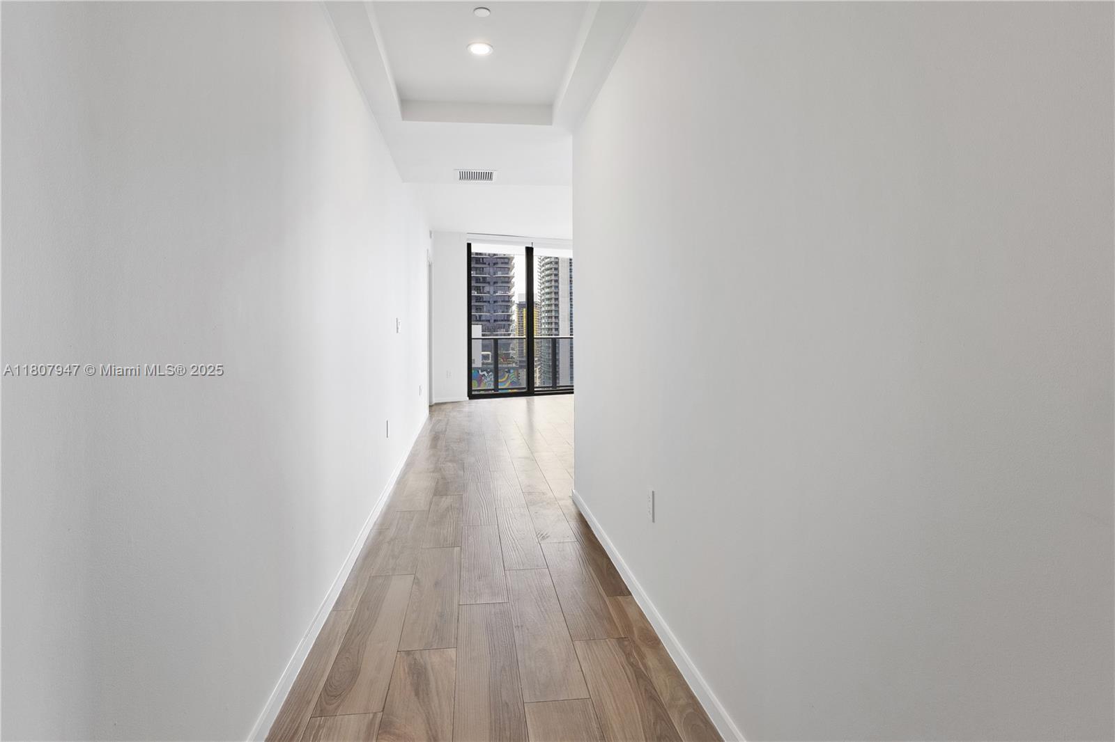 801 South Miami Avenue, Unit 2201 Miami, FL 33131 - Photo 13 of 37 a view of a hallway with wooden floor