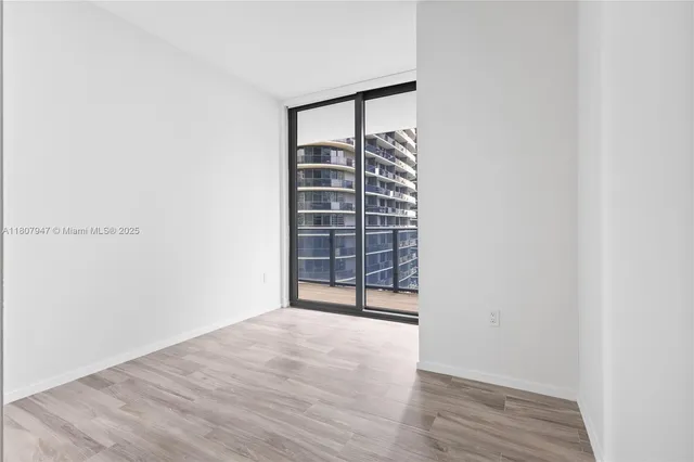 a bathroom with a sink toilet and a mirror