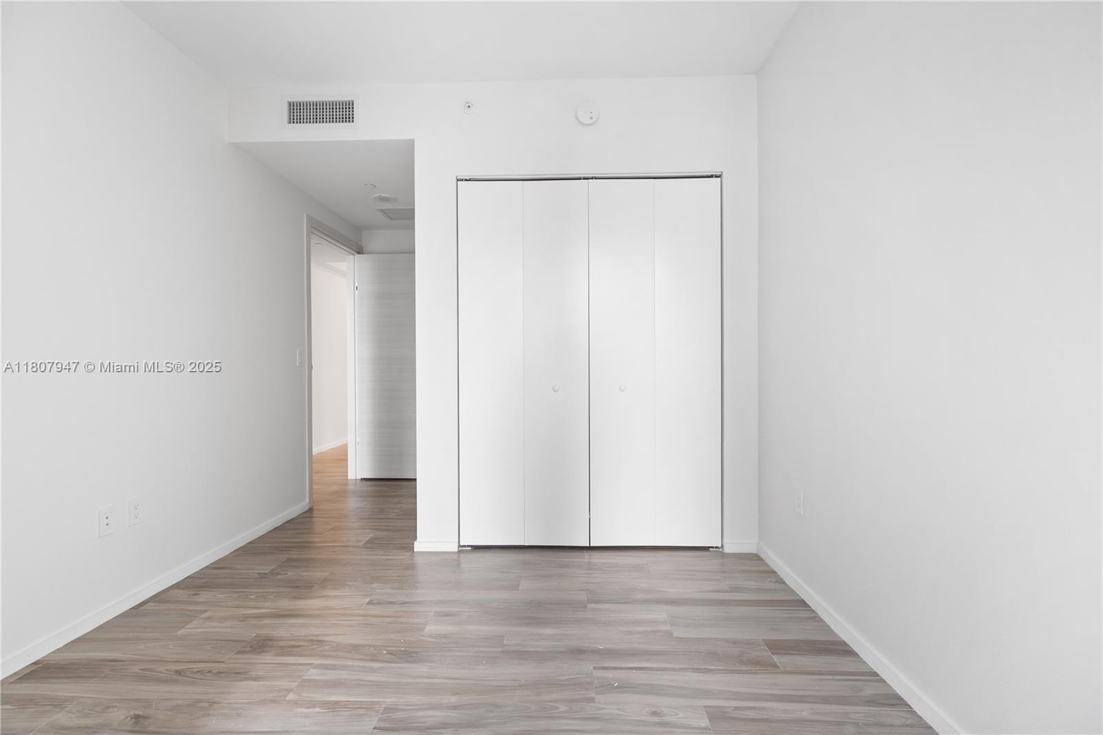 801 South Miami Avenue, Unit 2201 Miami, FL 33131 - Photo 29 of 37 a view of an empty room with wooden floor