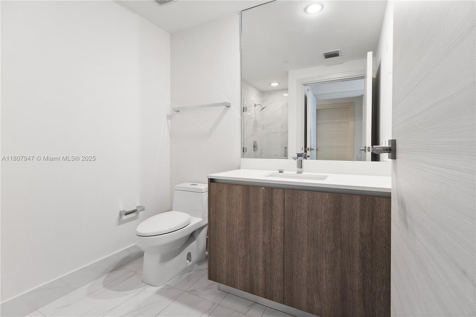 801 South Miami Avenue, Unit 2201 Miami, FL 33131 - Photo 34 of 37 a bathroom with a sink and a toilet