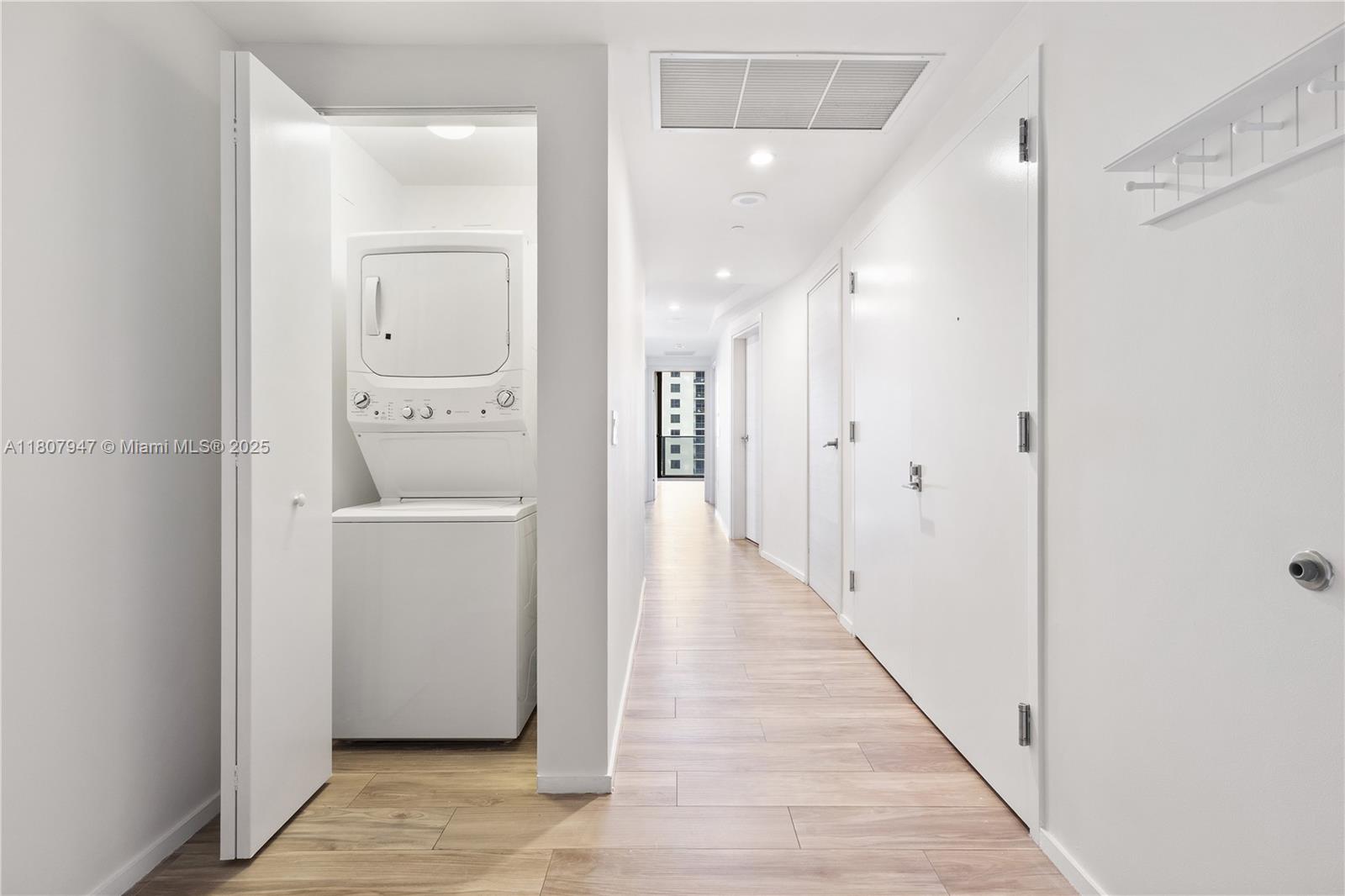 801 South Miami Avenue, Unit 2201 Miami, FL 33131 - Photo 36 of 37 a view of a hallway with wooden floor