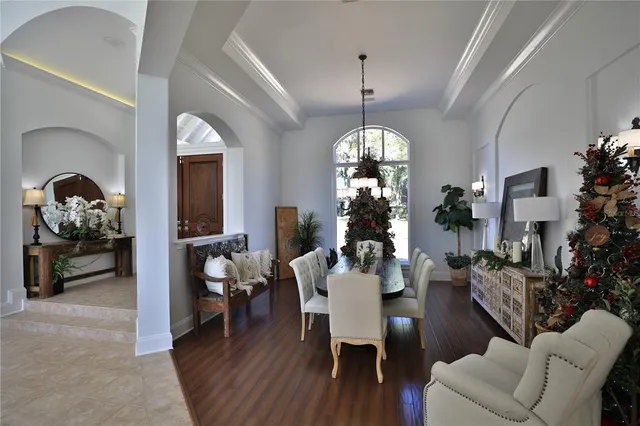 a view of a livingroom with furniture window and wooden floor