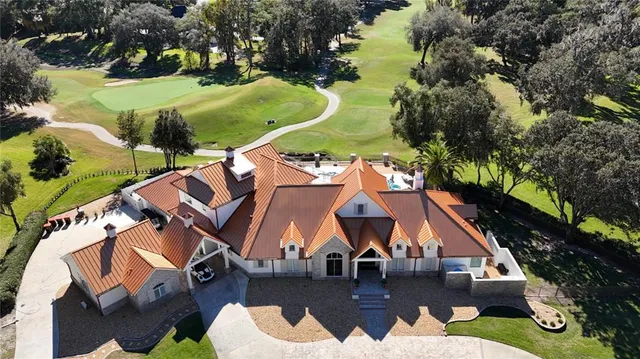 an aerial view of residential houses and outdoor space