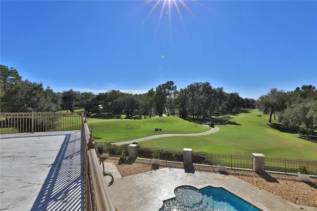 a view of a patio with a dining table and chairs