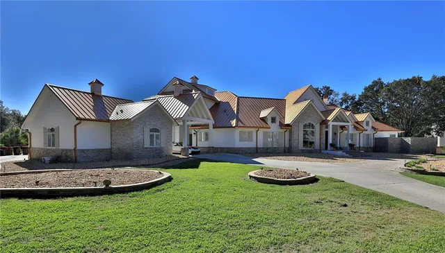 a front view of a house with a yard table and chairs