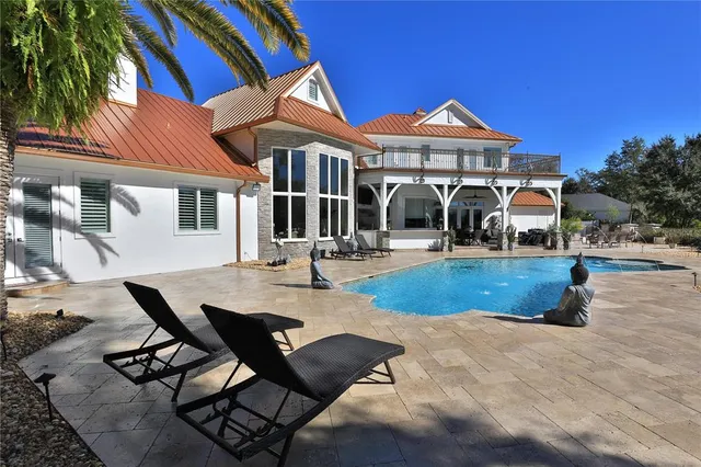 a front view of a house with swimming pool