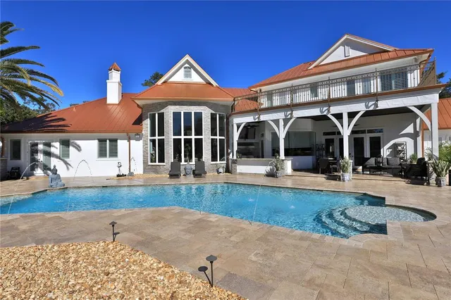 a view of a swimming pool with a patio