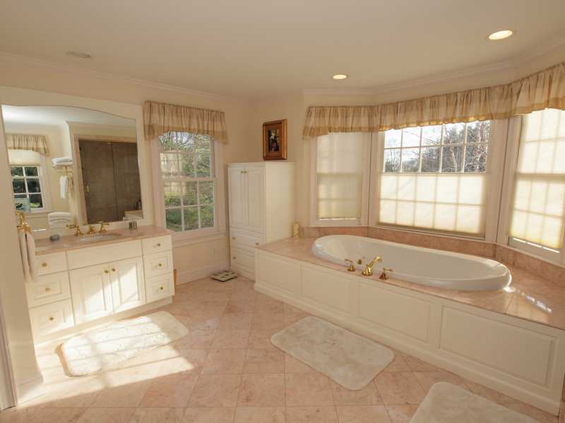 359 Mansfield Avenue Darien, CT 06820 - Photo 11 of 25 a spacious bathroom with a tub sink and mirror