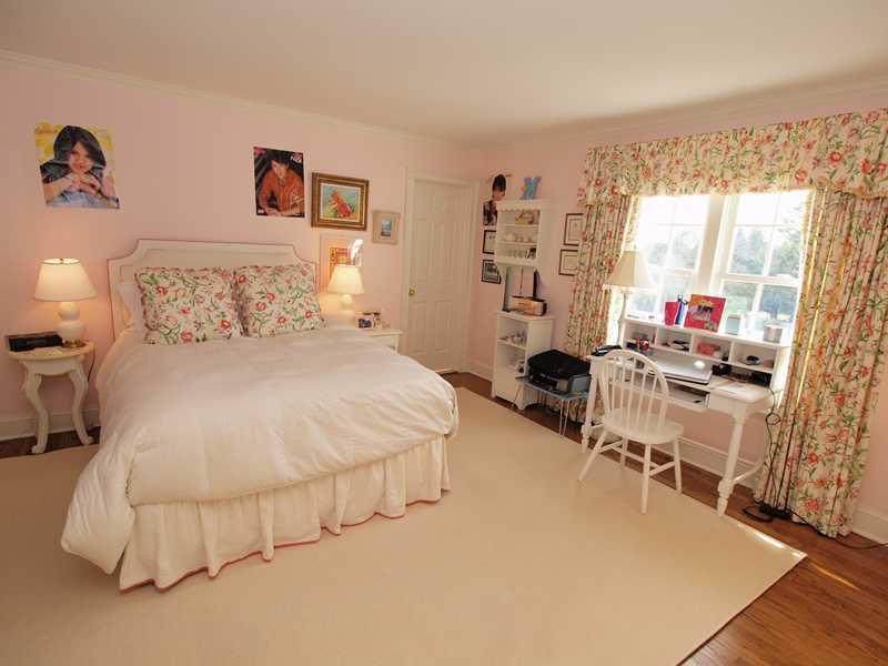 359 Mansfield Avenue Darien, CT 06820 - Photo 13 of 25 a bedroom with furniture and a large window
