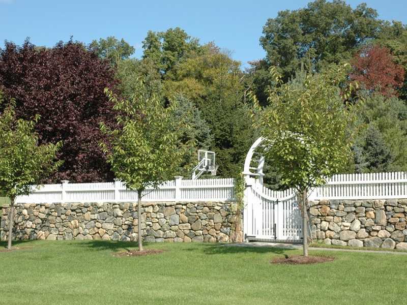 359 Mansfield Avenue Darien, CT 06820 - Photo 22 of 25 a front view of a house with a yard