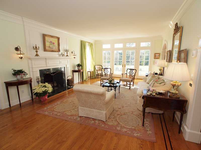 359 Mansfield Avenue Darien, CT 06820 - Photo 3 of 25 a living room with furniture large window and a fireplace