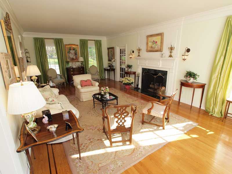 359 Mansfield Avenue Darien, CT 06820 - Photo 4 of 25 a living room with furniture a fireplace and a table