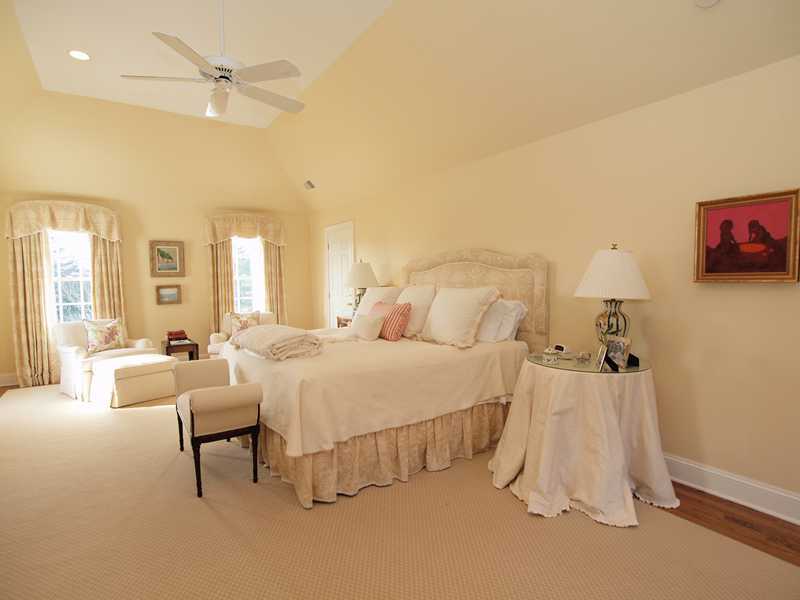 359 Mansfield Avenue Darien, CT 06820 - Photo 10 of 25 a spacious bedroom with a bed and a couch