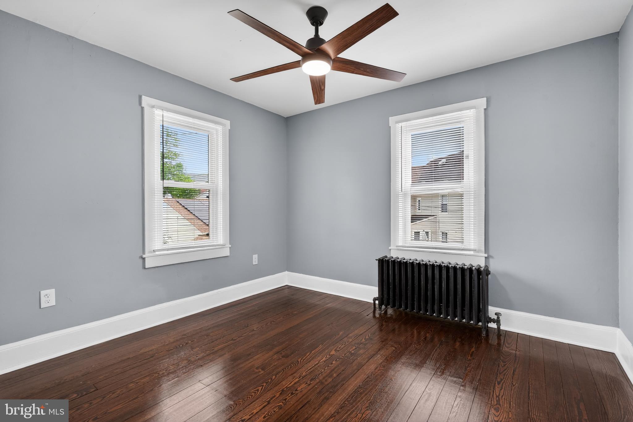 223 Noreg Place Brooklawn, NJ 08030 - Photo 27 of 36 a view of room with window hardwood floor and ceiling fan