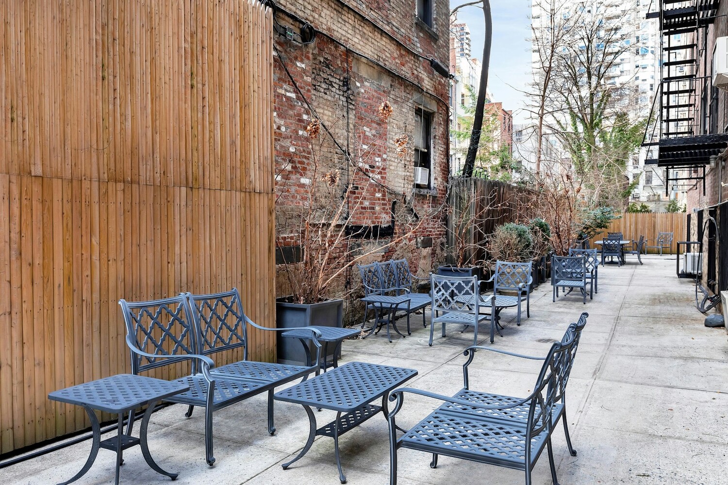 215 East 73rd Street, Unit 2A Manhattan, NY 10021 - Photo 17 of 20 a view of a patio with a table and chairs