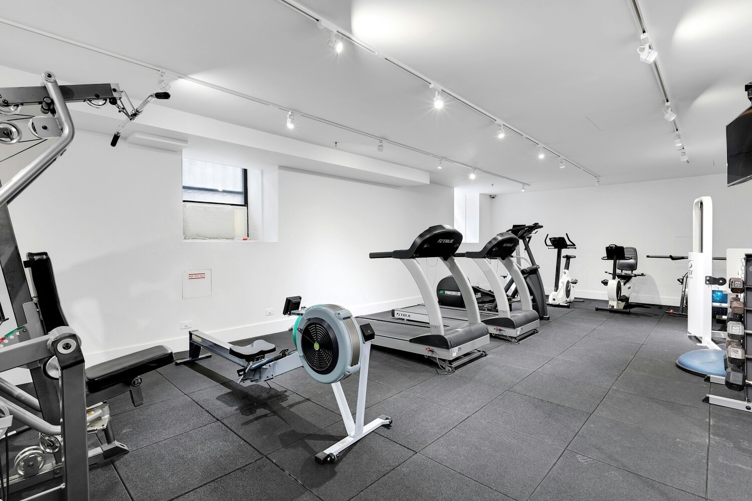 215 East 73rd Street, Unit 2A Manhattan, NY 10021 - Photo 18 of 20 a view of a room with gym equipment