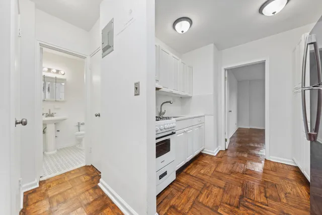 a kitchen with a sink and refrigerator