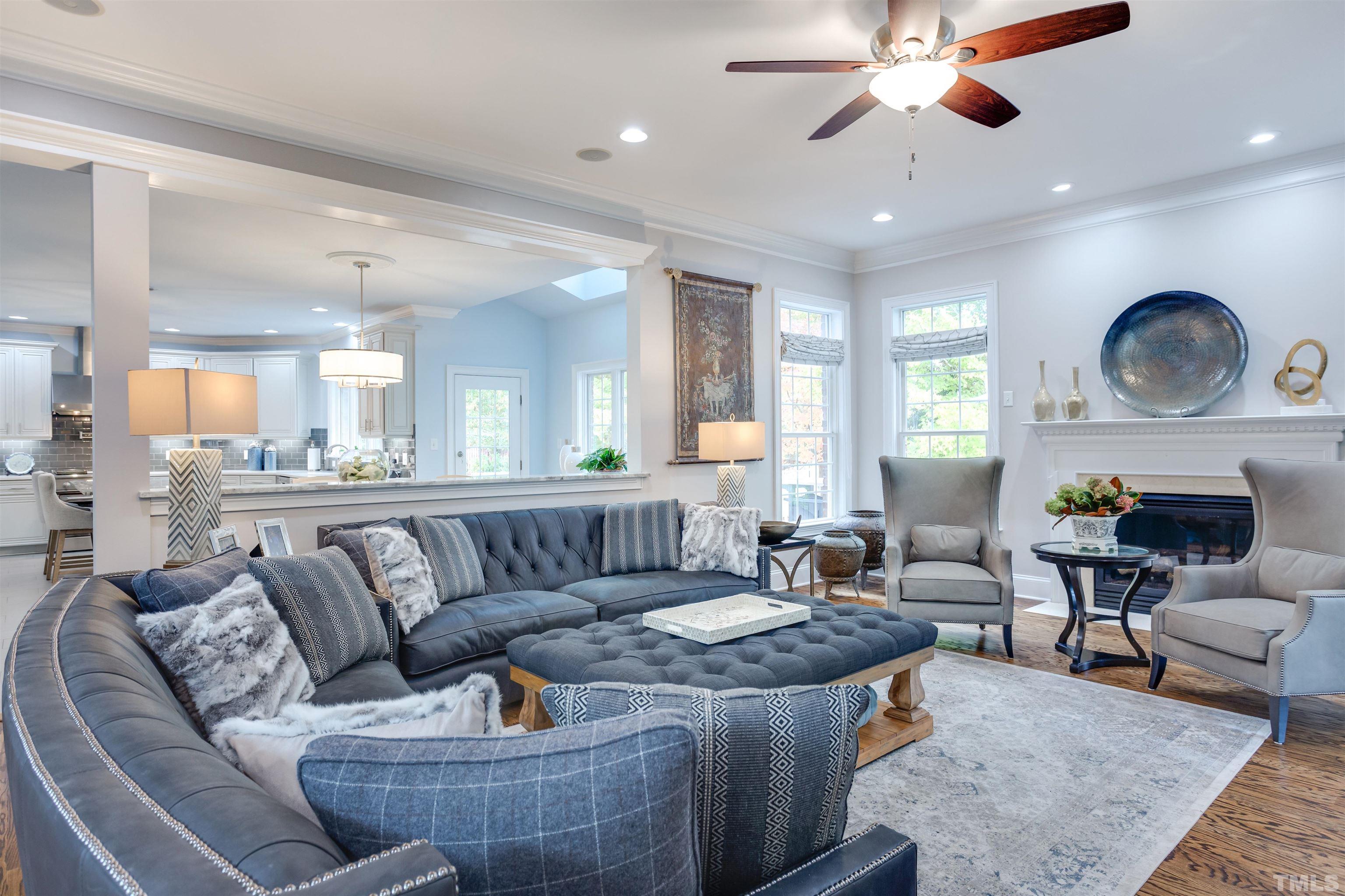 11313 Ridgegate Drive Raleigh, NC 27617 - Photo 33 of 82 a living room with furniture and a wooden floor