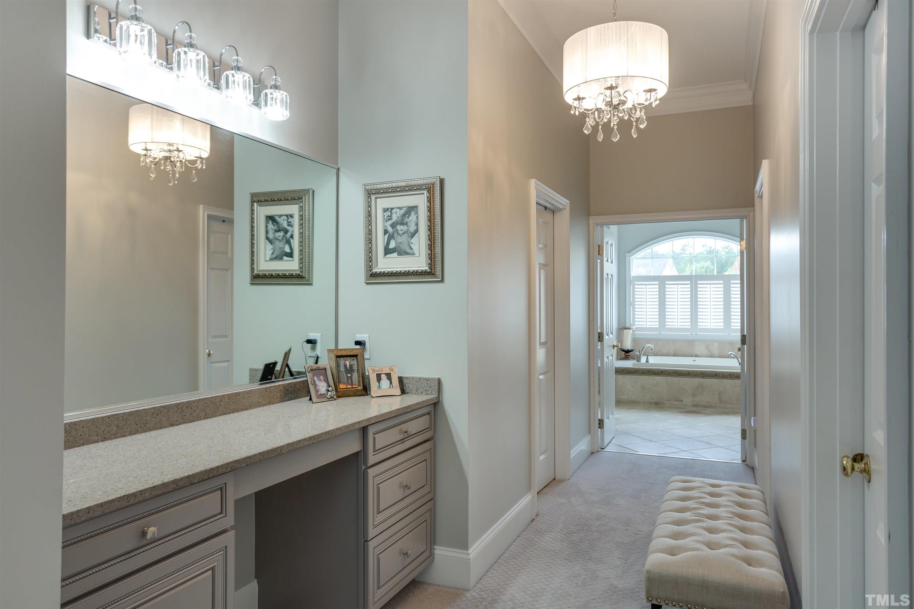 11313 Ridgegate Drive Raleigh, NC 27617 - Photo 61 of 82 a bathroom with a sink and a mirror