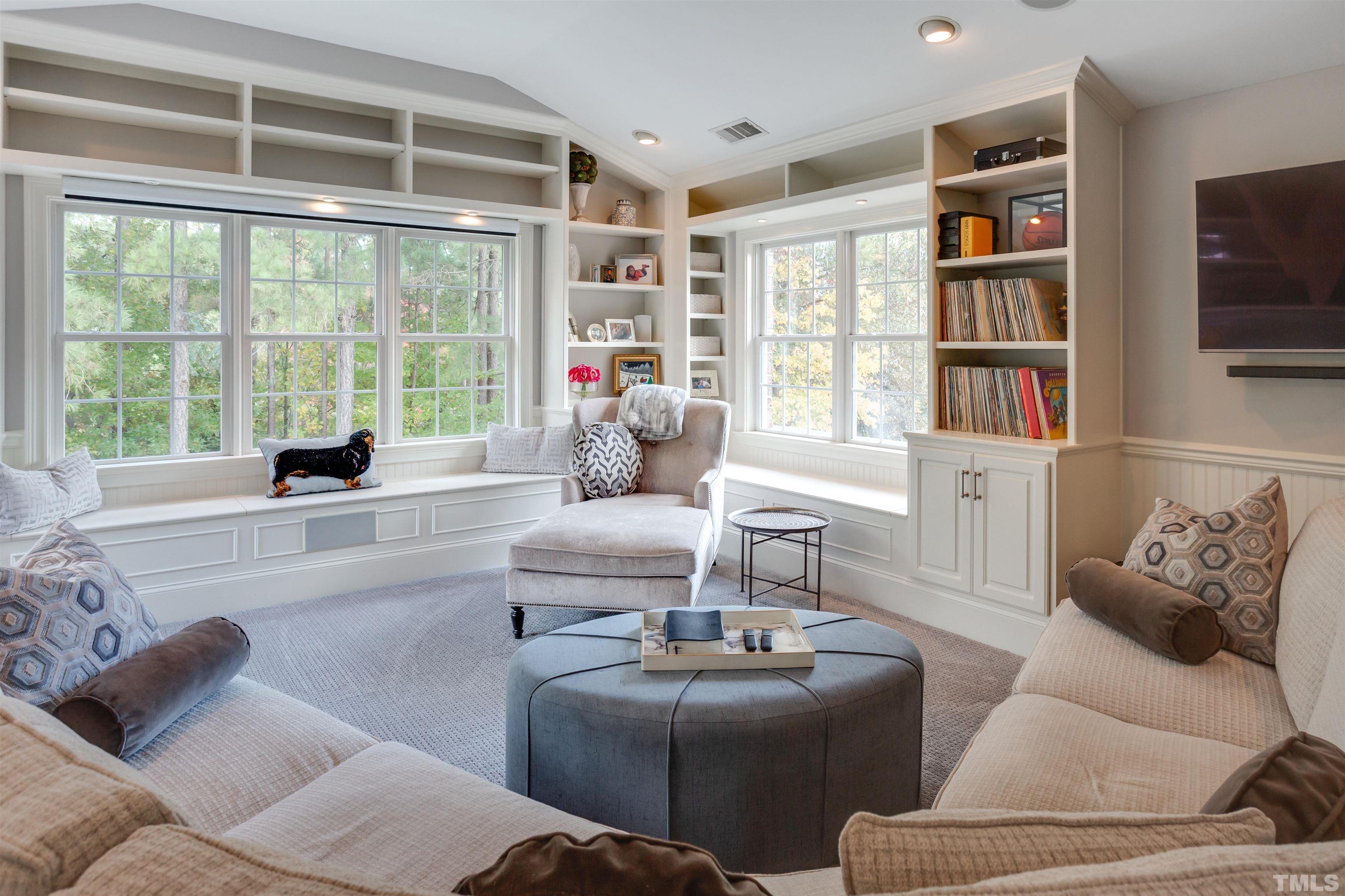 11313 Ridgegate Drive Raleigh, NC 27617 - Photo 67 of 82 a living room with furniture and a large window