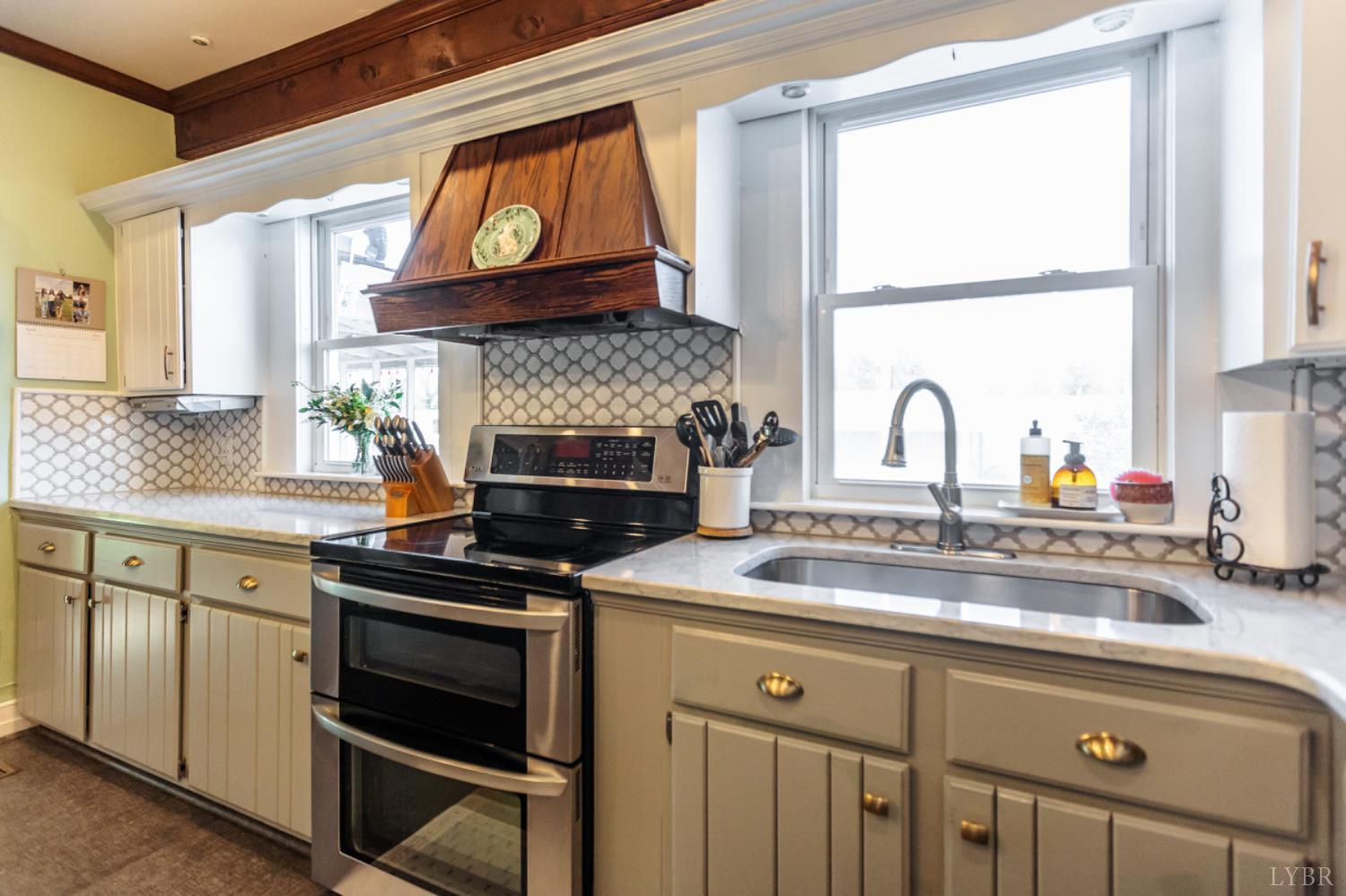 151 Burke Street Appomattox, VA 24522 - Photo 22 of 75 a kitchen with a stove a sink and a window