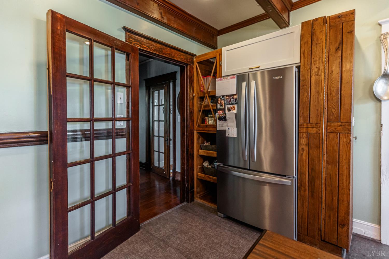 151 Burke Street Appomattox, VA 24522 - Photo 26 of 75 a kitchen with stainless steel appliances granite countertop a refrigerator and a wooden floor