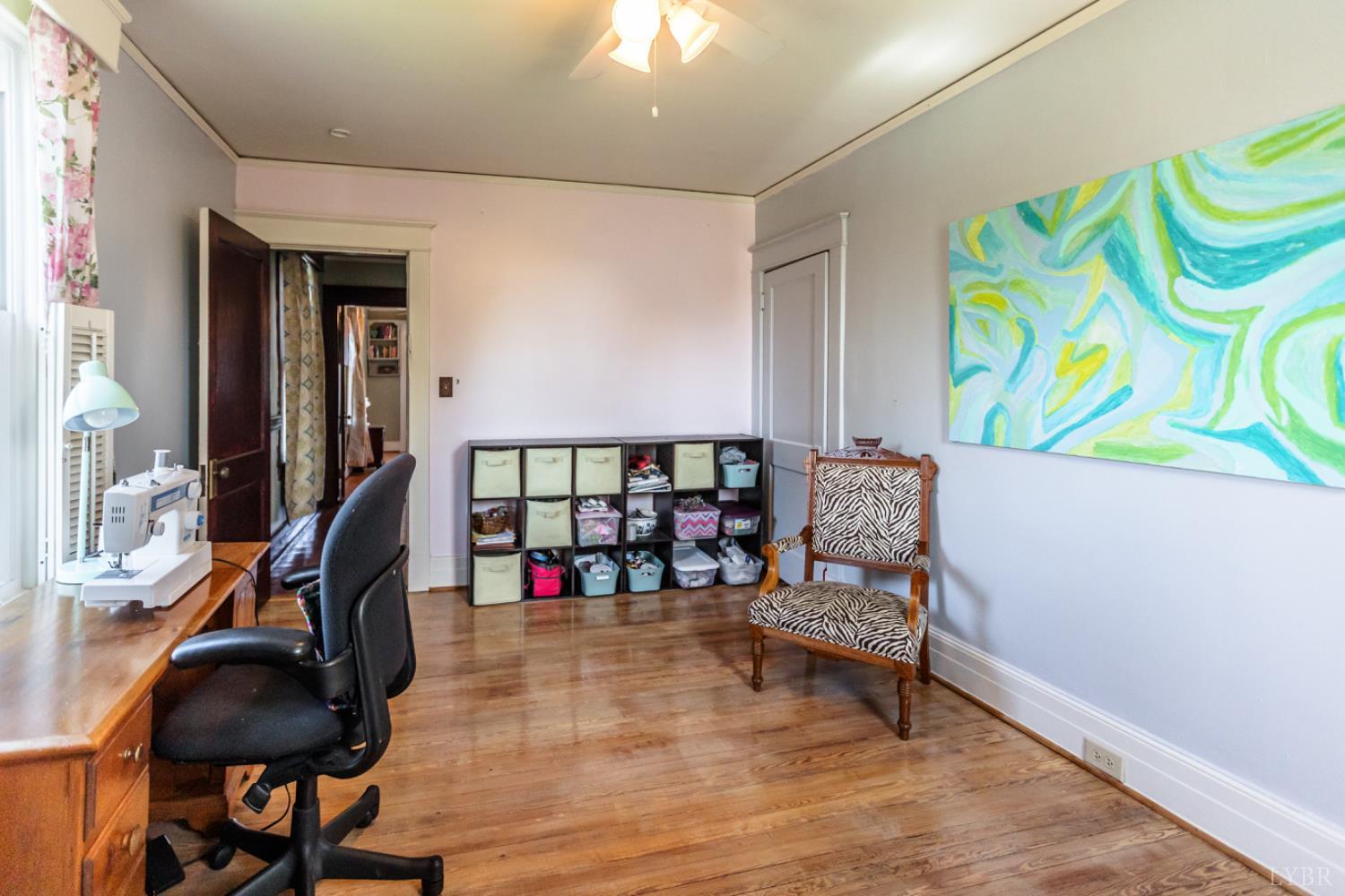 151 Burke Street Appomattox, VA 24522 - Photo 42 of 75 a living room with lots of furniture and a wooden floor