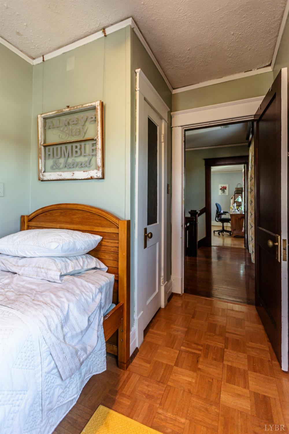 151 Burke Street Appomattox, VA 24522 - Photo 48 of 75 a bedroom with a bed and a view of bathroom